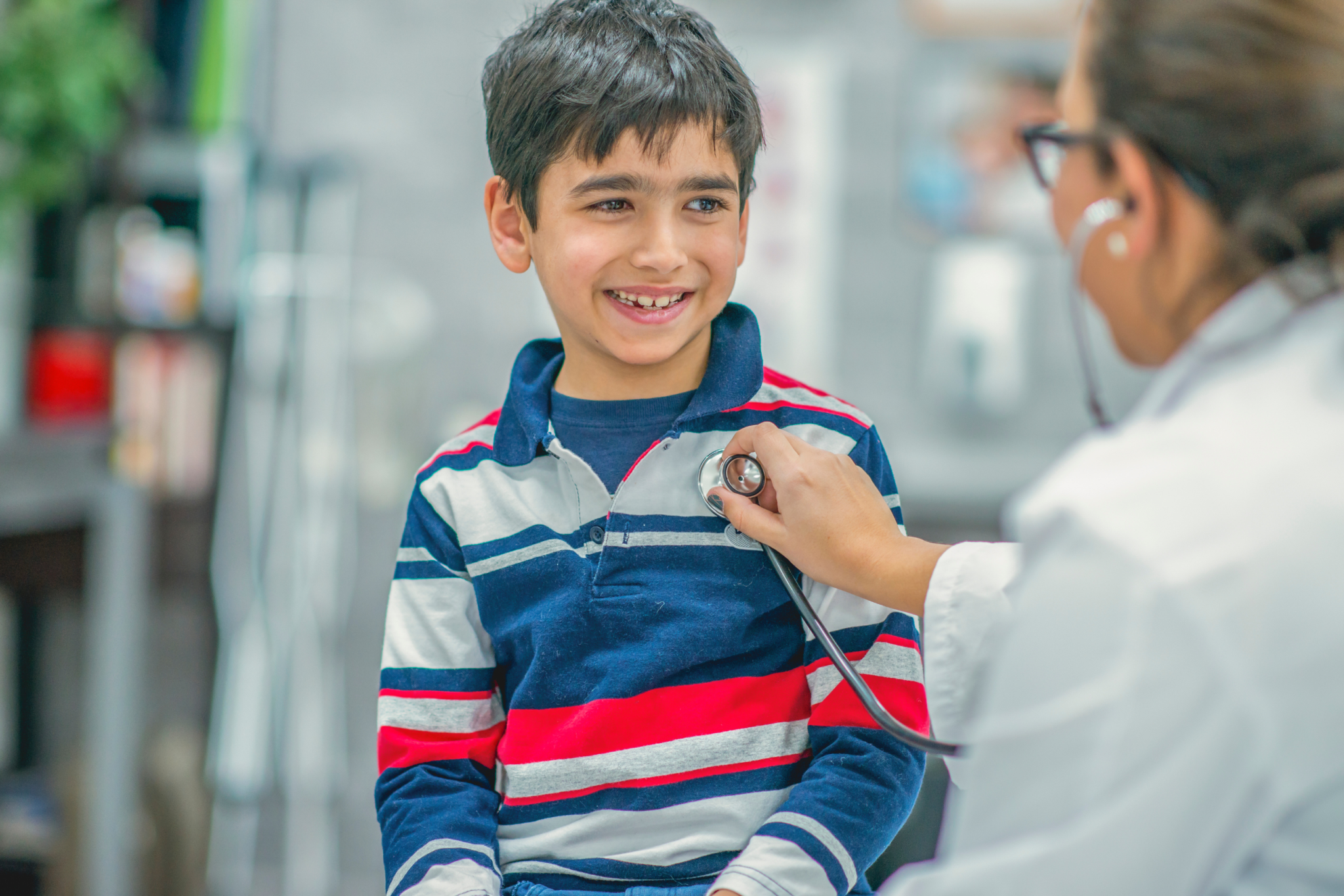 child talking with his physician